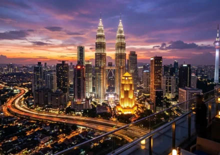 Petronas Towers lit up at dusk, one of the best things to do in Malaysia in Kuala Lumpur