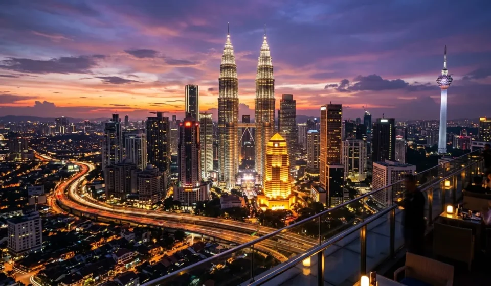 Petronas Towers lit up at dusk, one of the best things to do in Malaysia in Kuala Lumpur