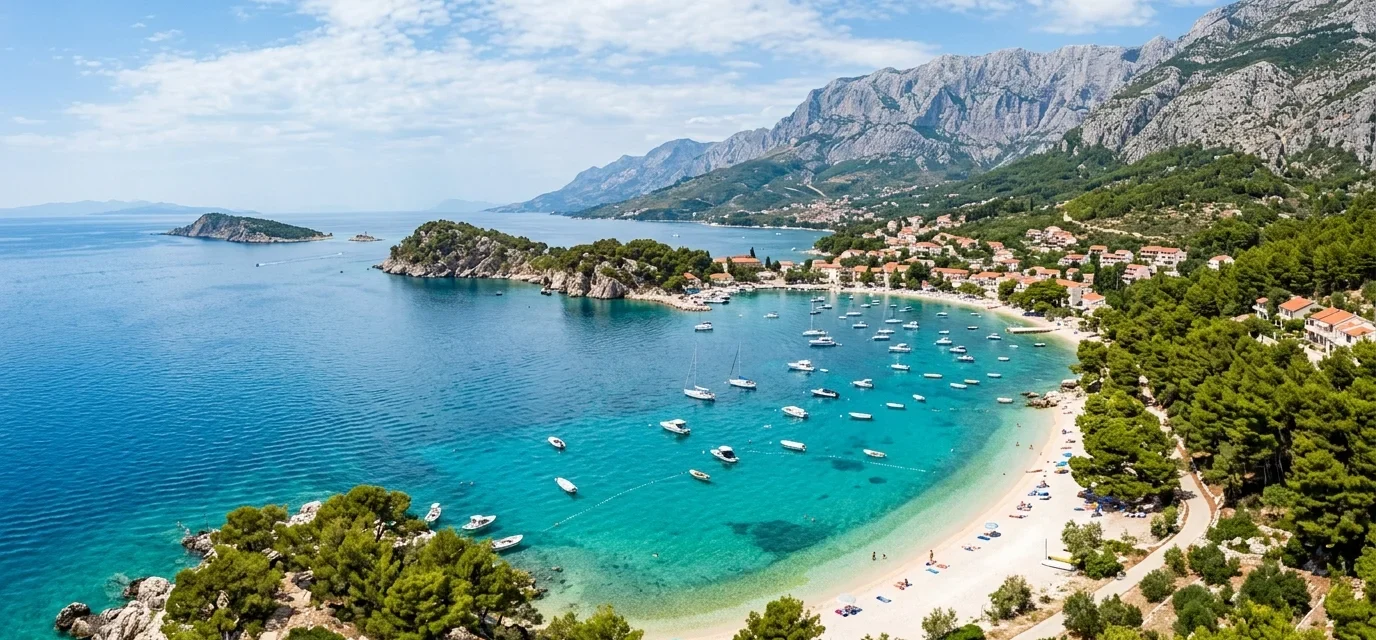 Turquoise water and a white pebble beach along the Croatian Adriatic coast, one of the best beaches in Croatia
