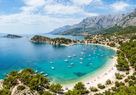 Turquoise water and a white pebble beach along the Croatian Adriatic coast, one of the best beaches in Croatia