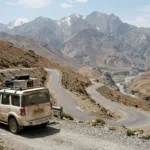 SUV driving a mountain highway on one of the best road trips in India